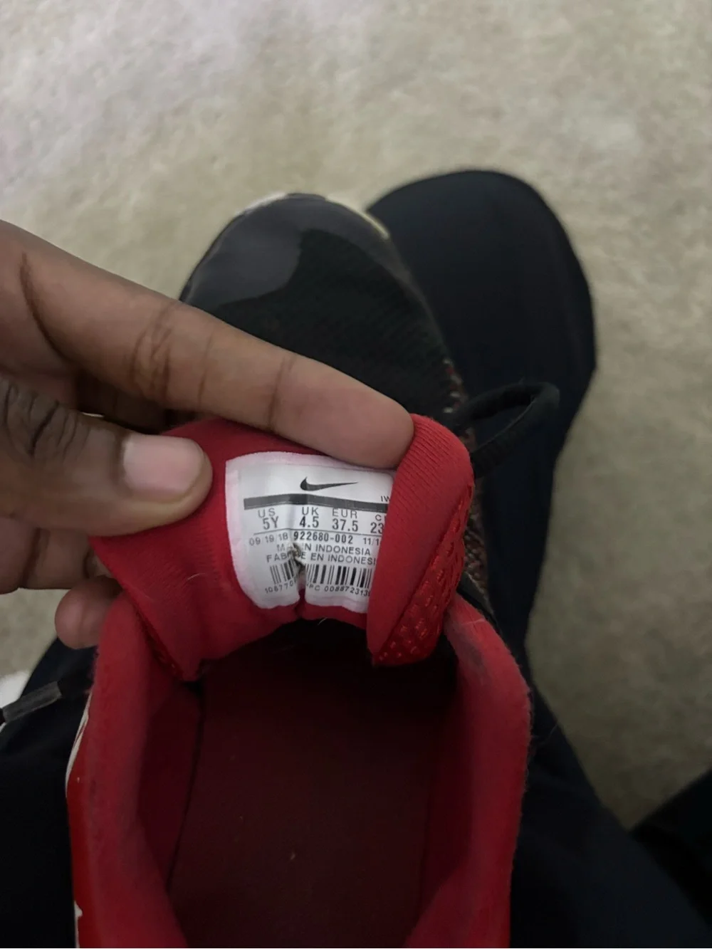 Nike Kids Black and Red Low-Top Sneakers with White Swoosh